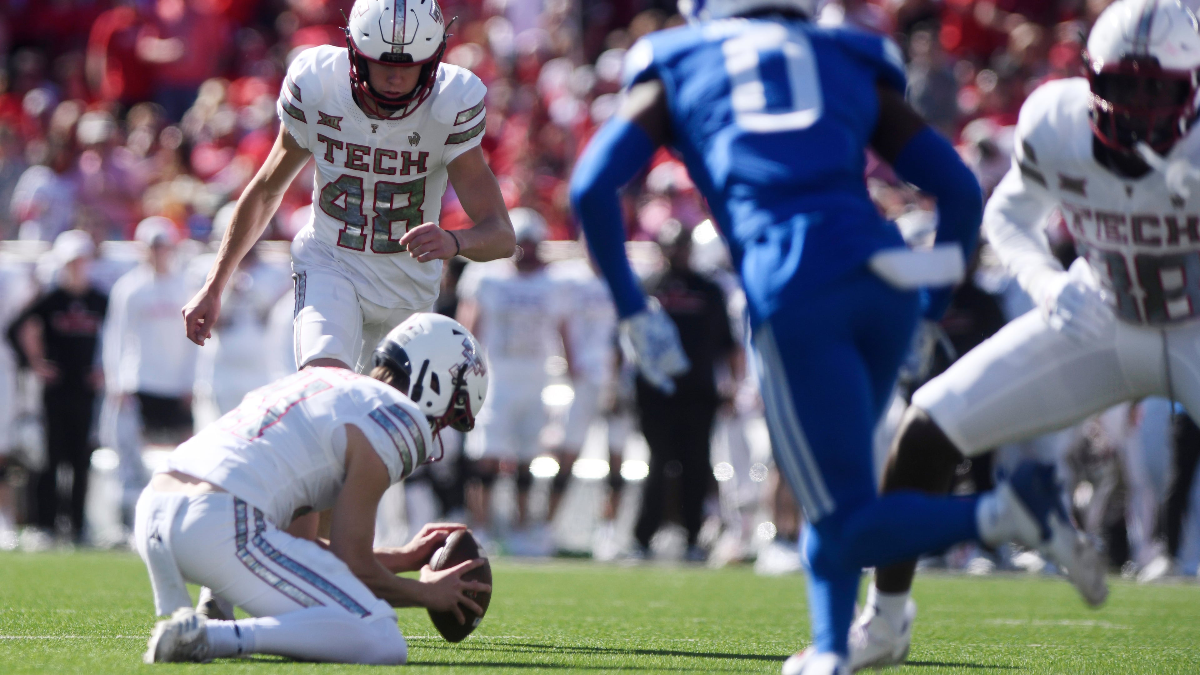 Texas Tech place kicker Stone Harrington (48) kicks a field goal during the first half of an NCAA college football game against BYU, Saturday, Nov. 8, 2025, in Lubbock, Texas. (AP Photo/Annie Rice)