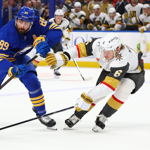 FILE - Buffalo Sabres right wing Alex Tuch (89) is stick checked by Vegas Golden Knights defenseman Kaedan Korczak (6) during the first period of an NHL hockey game, March 3, 2026, in Buffalo, N.Y. (AP Photo/Jeffrey T. Barnes, File)