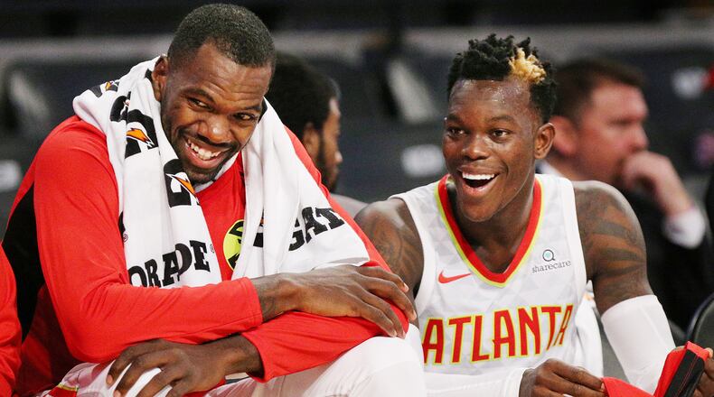 Hawks Dewayne Dedmon and Dennis Schroder share a laugh on the bench against the Grizzlies during the first half in a NBA preseason basketball game on Monday, October 9, 2017, in Atlanta.   Curtis Compton/ccompton@ajc.com