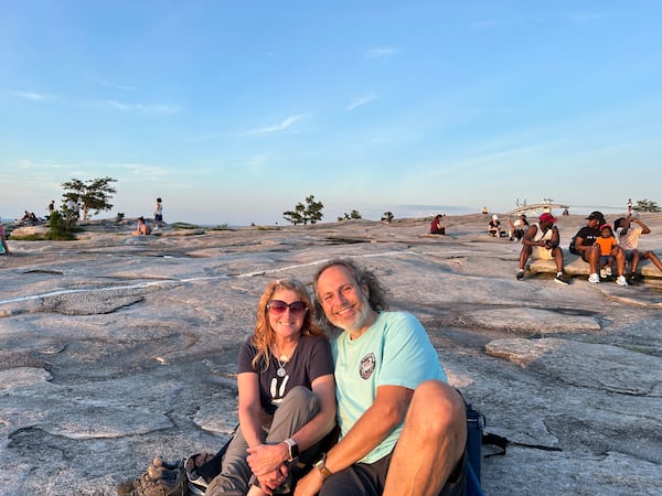 Tamara Hamilton, left, and Jim Ennis spent part of their third date together watching the sunset atop Stone Mountain on Friday, June 20, 2025, the longest day of the year. (Thomas Lake/AJC)