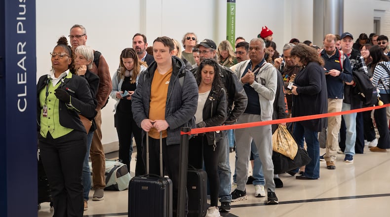 Early morning travelers wait in long lines Hartsfield-Jackson Atlanta International Airport amid the ongoing partial government shutdown, Wednesday, March 18, 2026. (Ben Hendren for the AJC)