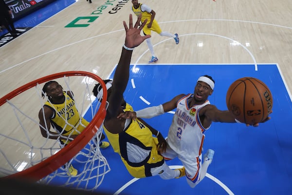 Oklahoma City Thunder guard Shai Gilgeous-Alexander (2) shoots around Indiana Pacers forward Pascal Siakam during the second half of Game 5 of the NBA Finals basketball series, Monday, June 16, 2025, in Indianapolis. (Matthew Stockman/Pool Photo via AP)