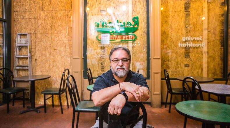 Claudio Furgiuele is the owner of Ruben’s Deli, a New York style deli on Broad Street in the Fairlie-Poplar District downtown Wednesday, June 17, 2020. Rioters broke windows throughout downtown. (Jenni Girtman for The Atlanta Journal-Constitution)