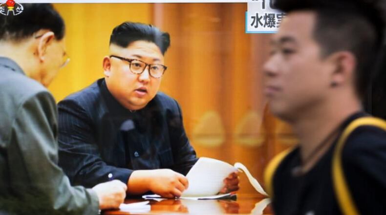 A monitor shows an image of North Korean leader Kim Jong-Un during a news program .