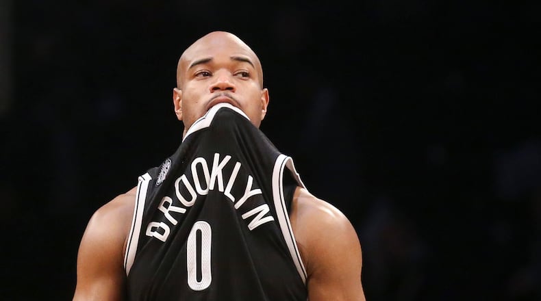 Brooklyn Nets guard Jarrett Jack (0) reacts in the second half their NBA basketball game against the Miami Heat at the Barclays Center, Tuesday, Dec. 16, 2014, in New York. The Heat won, 95-91. (AP Photo/John Minchillo)