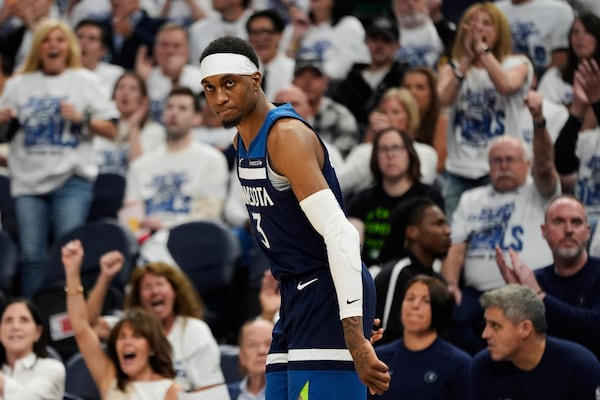 Minnesota Timberwolves forward Jaden McDaniels (3) reacts after making a 3-pointer against Oklahoma City Thunder during the second half of Game 3 of the Western Conference finals of the NBA basketball playoffs, Saturday, May 24, 2025, in Minneapolis. (AP Photo/Abbie Parr)