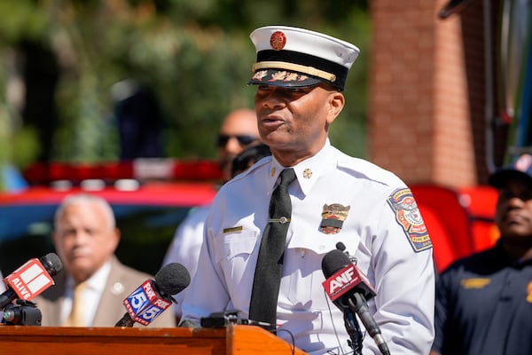 DeKalb County fire Chief Darnell Fullum briefs reporters at a Tuesday news conference about firefighter Preston Fant, who died the day before after battling a fire at a warehouse. (Ben Hendren for the AJC)