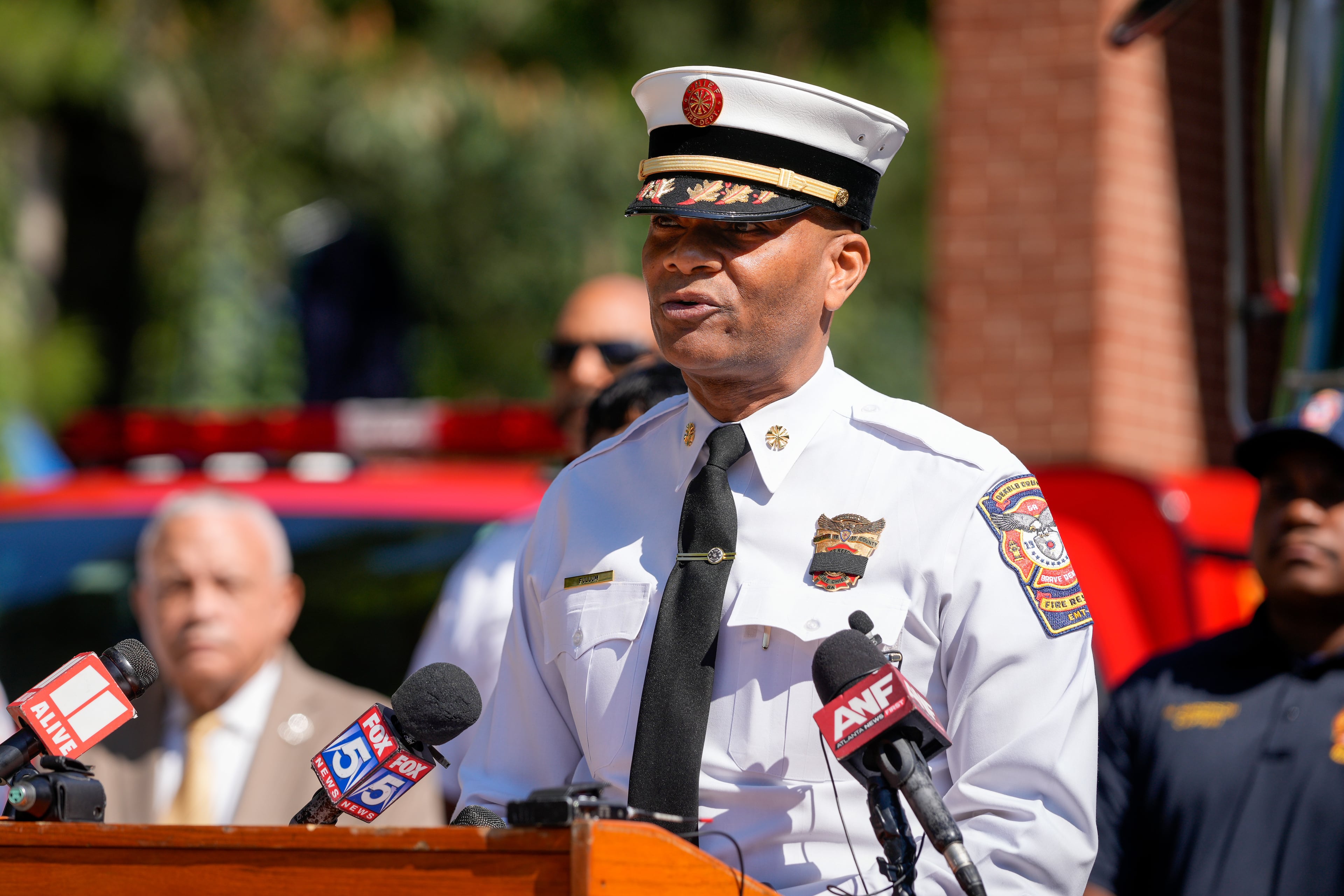 DeKalb County fire Chief Darnell Fullum briefs reporters at a Tuesday news conference about firefighter Preston Fant, who died the day before after battling a fire at a warehouse. (Ben Hendren for the AJC)