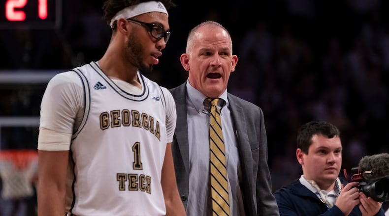 Georgia Tech assistant coach Eric Reveno with Yellow Jackets center James Banks during a Feb. 25, 2020 game at McCamish Pavilion.