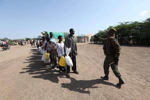 Refugees waiting in a queue to receive humanitarian aid distributed by the World Food Programme (WFP) at Kakuma Refugee Camp in Turkana, Kenya Wednesday, June 4, 2025. (AP Photo/Andrew)
