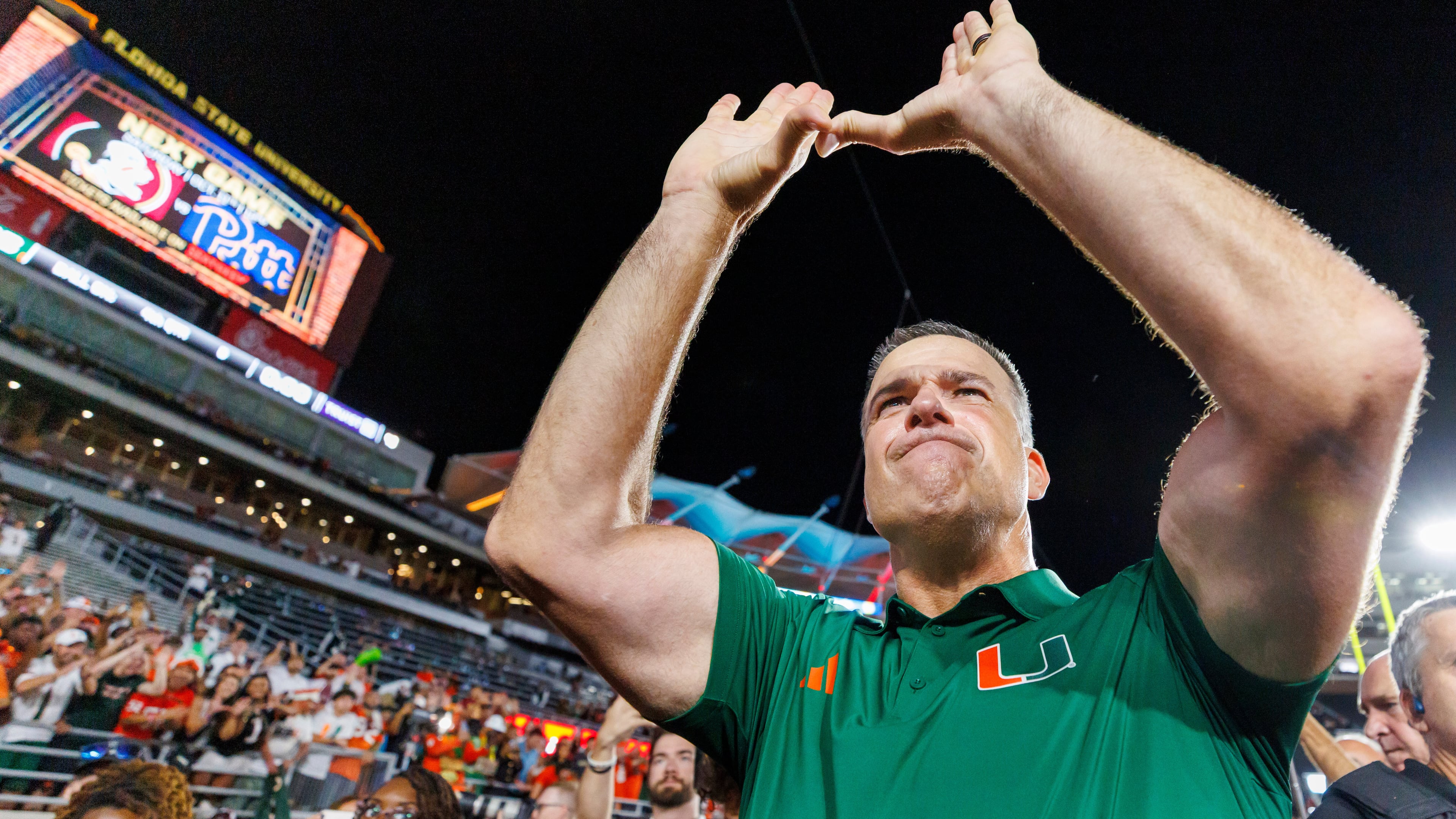 Miami head coach Mario Cristobal celebrates defeating Florida State in a NCAA college football game, Saturday, Oct. 4, 2025, in Tallahassee, Fla. (AP Photo/Colin Hackley)