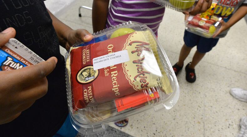 The DeKalb County School District’s Nutrition Services department is offering meals on Mondays, Wednesdays and Fridays to all children up to 18 years old. Families can pick up the food from 11 a.m. to 1 p.m. HYOSUB SHIN / HSHIN@AJC.COM