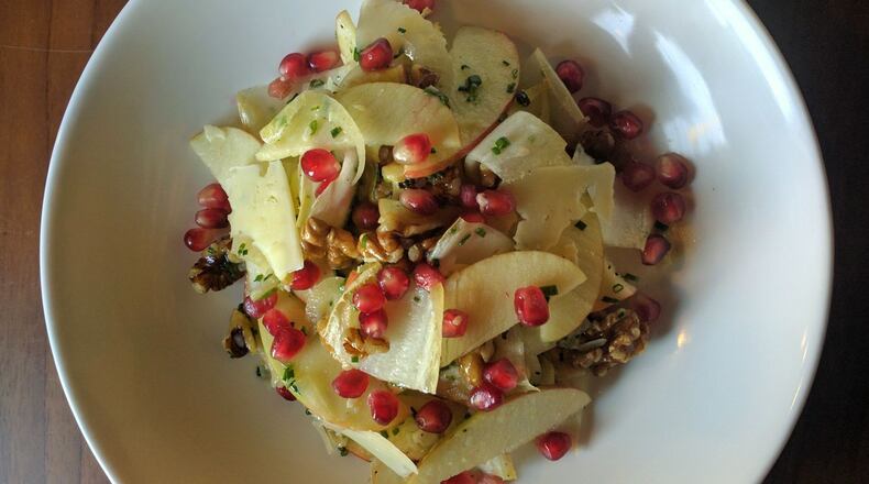 An apple and belgian endive salad is sprinkled with pomegranite seeds. CONTRIBUTED BY: Courtesy Spring restaurant