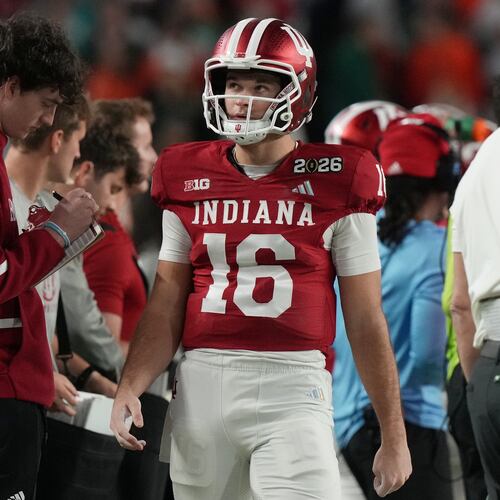 Indiana quarterback Alberto Mendoza (16) walks the sidelines during the College Football Playoff national championship game against Miami, Tuesday, Jan. 20, 2026, in Miami Gardens, Fla. (AP Photo/Marta Lavandier)