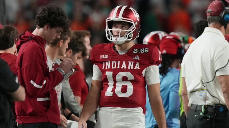 Indiana quarterback Alberto Mendoza (16) walks the sidelines during the College Football Playoff national championship game against Miami, Tuesday, Jan. 20, 2026, in Miami Gardens, Fla. (AP Photo/Marta Lavandier)