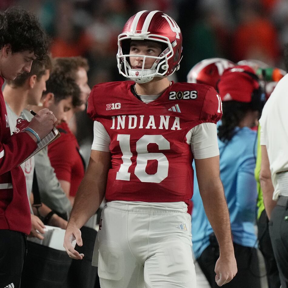 Indiana quarterback Alberto Mendoza (16) walks the sidelines during the College Football Playoff national championship game against Miami, Tuesday, Jan. 20, 2026, in Miami Gardens, Fla. (AP Photo/Marta Lavandier)