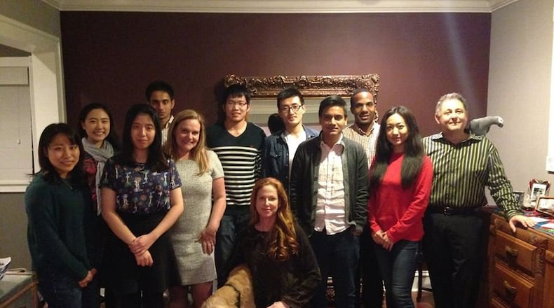 Wendy Kohn, kneeling in front row, and husband Paul Kohn, far right, pictured here in 2015 with their international Thanksgiving guests, will open up their home to area college students again on Thursday to share turkey, conversation, and tradition with about a dozen students from countries including China and India.