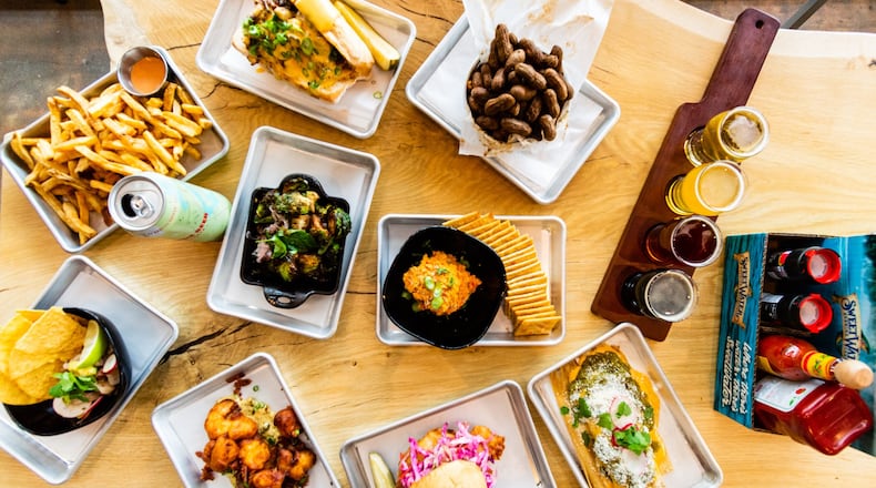 SweetWater’s renovated taproom, which opened in April, is an example of dining playing a bigger role in metro Atlanta’s growing beer scene. CONTRIBUTED BY HENRI HOLLIS