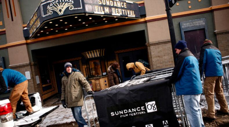 Before the celebrities started rolling in to Park City, Utah, for the Sundance Film Festival, the little town of 7,882 (not counting tourists) began preparations for the Hollywood crush. Here, volunteers hang banners outside Main Street's Egyptian Theater, which will screen some of the festival films. The film fest started Jan. 17 and continues through Jan. 27.