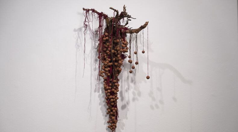 Sonya Yong James’ artwork “Home,” features root, Georgia red clay and cotton thread. Photo credit: Ashley Kauschinger