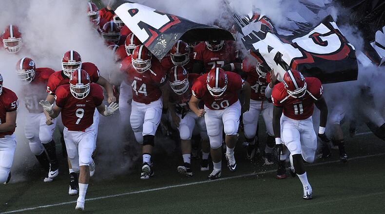 Aug. 24, 2012, COLLEGE PARK, GA: The Woodward Academy War Eagles take the field against Lovett for the first half of their high school football game at Woodward Academy's Colquitt Stadium in College Park, Ga., on Friday, Aug. 24, 2012. DAVID TULIS/AJC SPECIAL