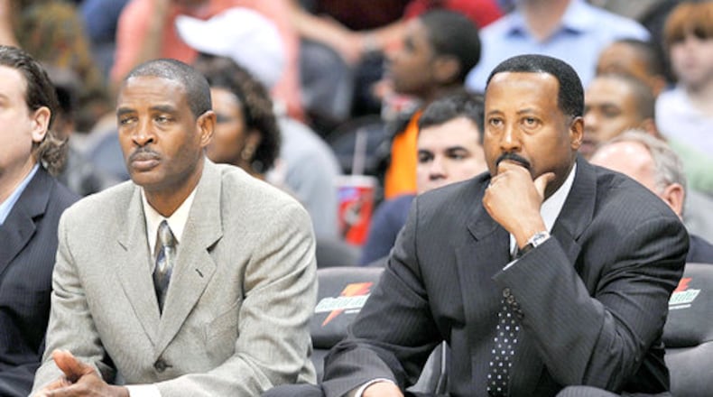 Larry Drew (left) and Mike Woodson during happier times. (Rich Addicks/AJC)
