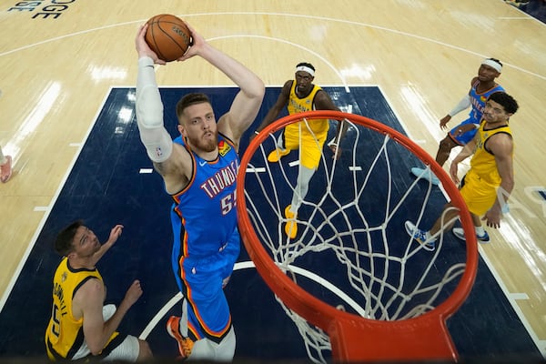 Oklahoma City Thunder center Isaiah Hartenstein (55) dunks against the Indiana Pacers during the first half of Game 3 of the NBA Finals basketball series, Wednesday, June 11, 2025, in Indianapolis. (AP Photo/Abbie Parr)