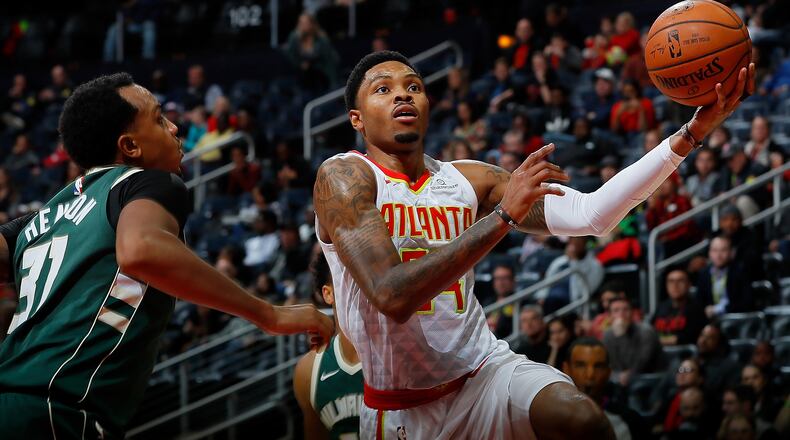 Kent Bazemore  of the Atlanta Hawks drives against John Hensonof the Milwaukee Bucks at Philips Arena on October 29, 2017 in Atlanta, Georgia.  (Photo by Kevin C. Cox/Getty Images)