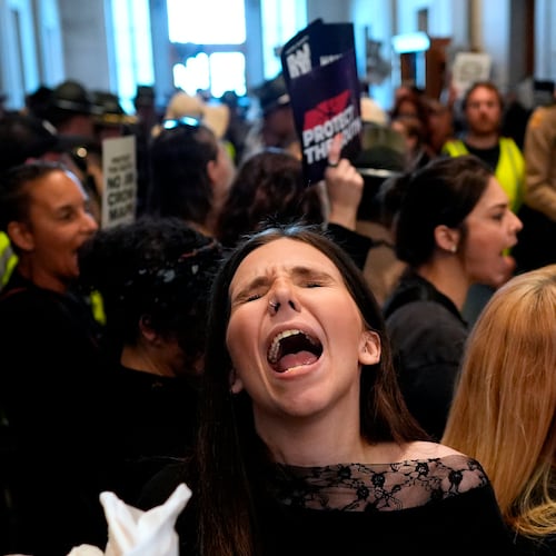 A woman protests outside the House chamber before a special session of the state legislature to redraw U.S. Congressional voting maps Thursday, May 7, 2026, in Nashville, Tenn. (AP Photo/George Walker IV)