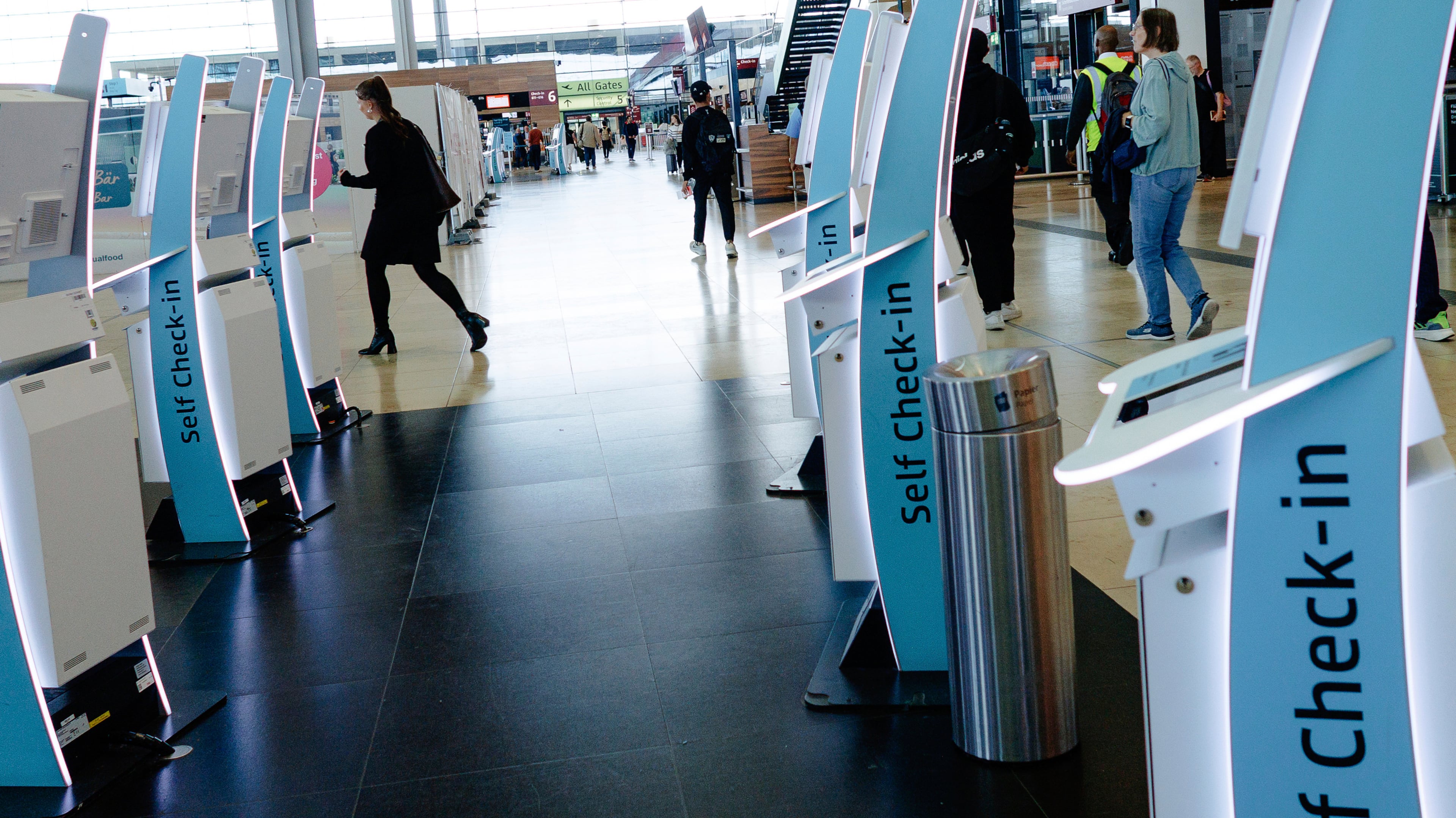 Check-in counters at a terminal at Berlin's Brandenburg airport, in Schönefeld, Germany, Saturday Sept. 20, 2025, after a cyberattack targeting check-in and boarding systems disrupted air traffic at several major European airports. (Carsten Koall/dpa via AP)