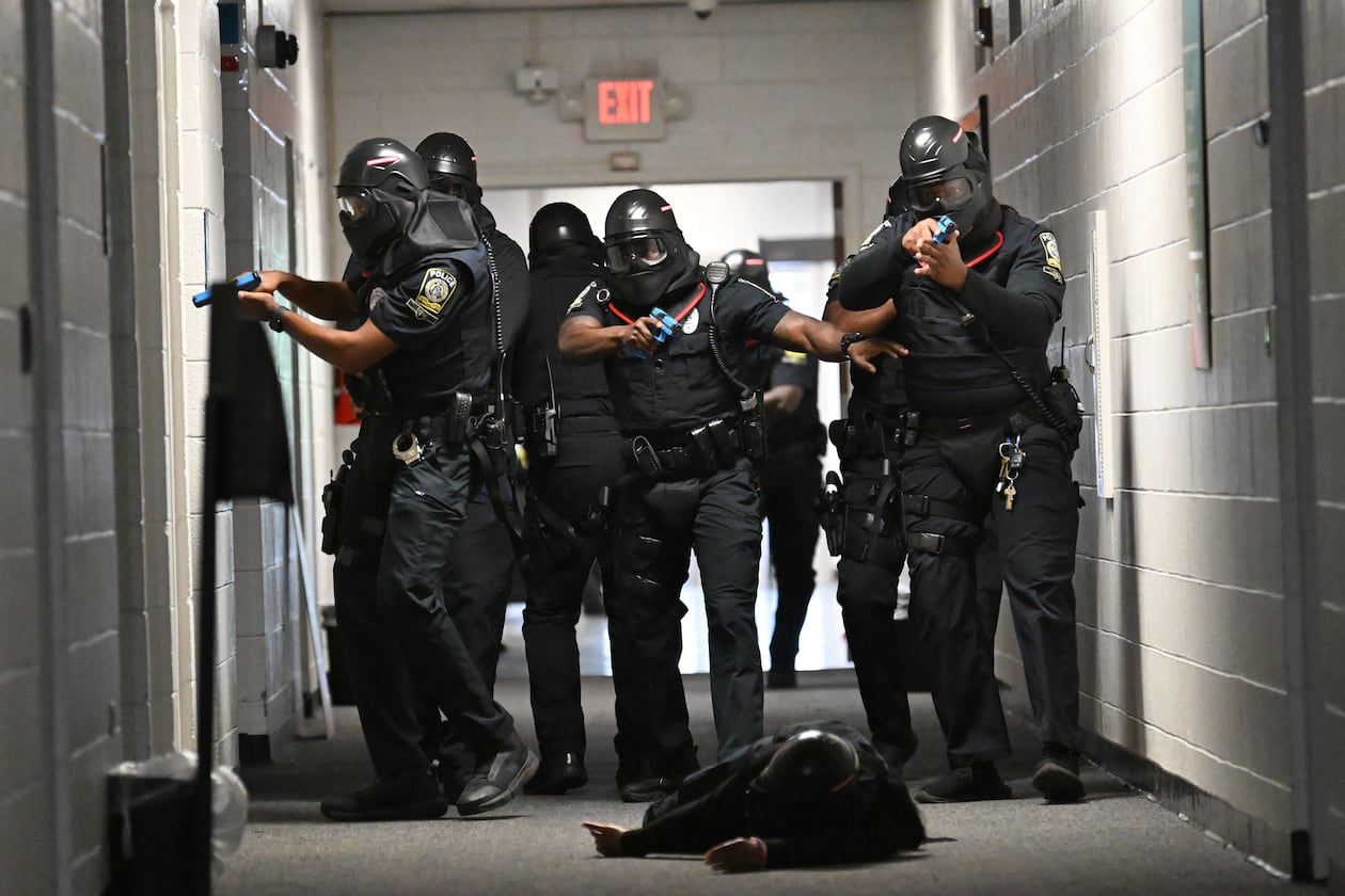 Atlanta Public Schools’ new tactical team conducts a training scenario demonstration for members of the media at Atlanta Public Schools’ Brewer Training Center on Tuesday, July 21, 2026, in Atlanta. Atlanta Public Schools is adding two new units to its security apparatus to keep students and employees safe: a tactical team and a drone team. (Hyosub Shin/AJC)