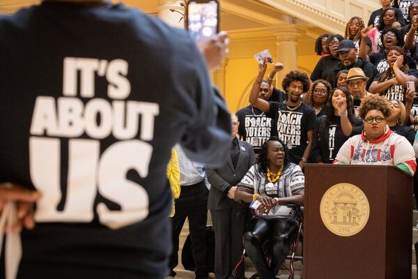 Kimberlyn Carter (right), executive director of Rep GA, speaks at a Black Voters Matter press conference at the Capitol in Atlanta on Wednesday, Feb. 28, 2024. (Arvin Temkar/AJC)