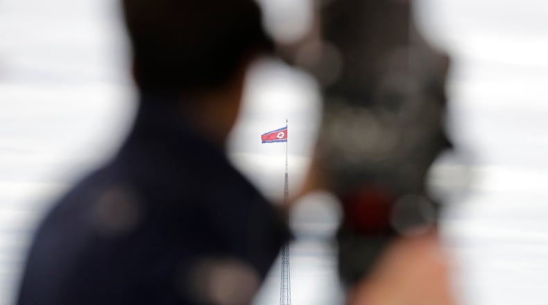 FILE - A North Korean flag flutters in the wind atop a 160-meter tower in North Korea's village Gijungdong as seen from the Taesungdong freedom village inside the demilitarized zone in Paju, South Korea on April 24, 2018. (AP Photo/Lee Jin-man, File)