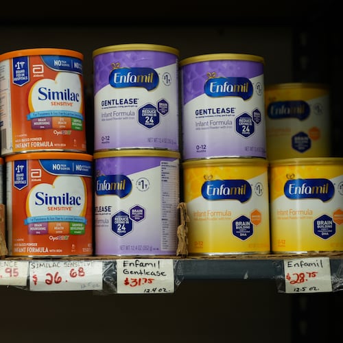Canisters of infant formula are priced as high as $31.75 per 12.4-ounces at a market serving the Central American immigrant community in the Westlake/Pico Union area of Los Angeles, Tuesday, April 7, 2026. (AP Photo/Damian Dovarganes)