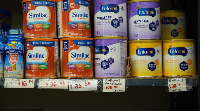 Canisters of infant formula are priced as high as $31.75 per 12.4-ounces at a market serving the Central American immigrant community in the Westlake/Pico Union area of Los Angeles, Tuesday, April 7, 2026. (AP Photo/Damian Dovarganes)