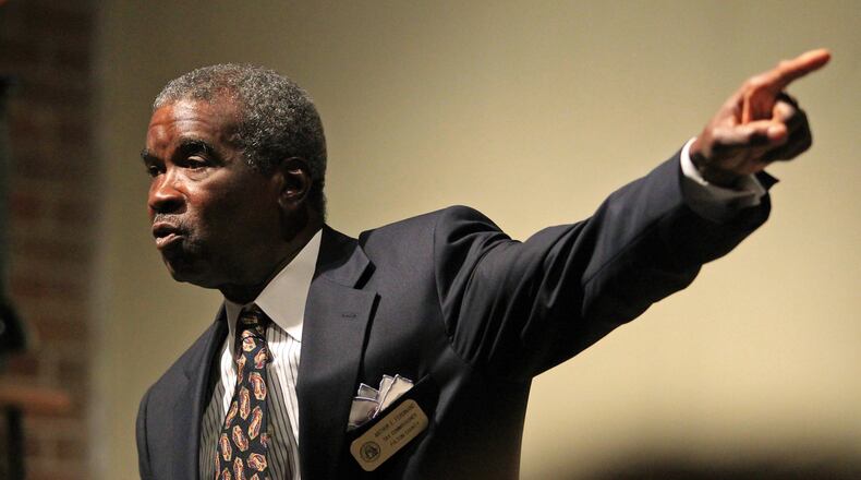Longtime Fulton County Tax Commissioner Arthur Ferdinand talks during a candidate forum at the Fulton County Democratic Party in July 2012. Ferdinand has sparked outrage by pocketing personal fees for collecting three cities’ taxes, making him the state’s highest-paid elected official. JASON GETZ / JGETZ@AJC.COM