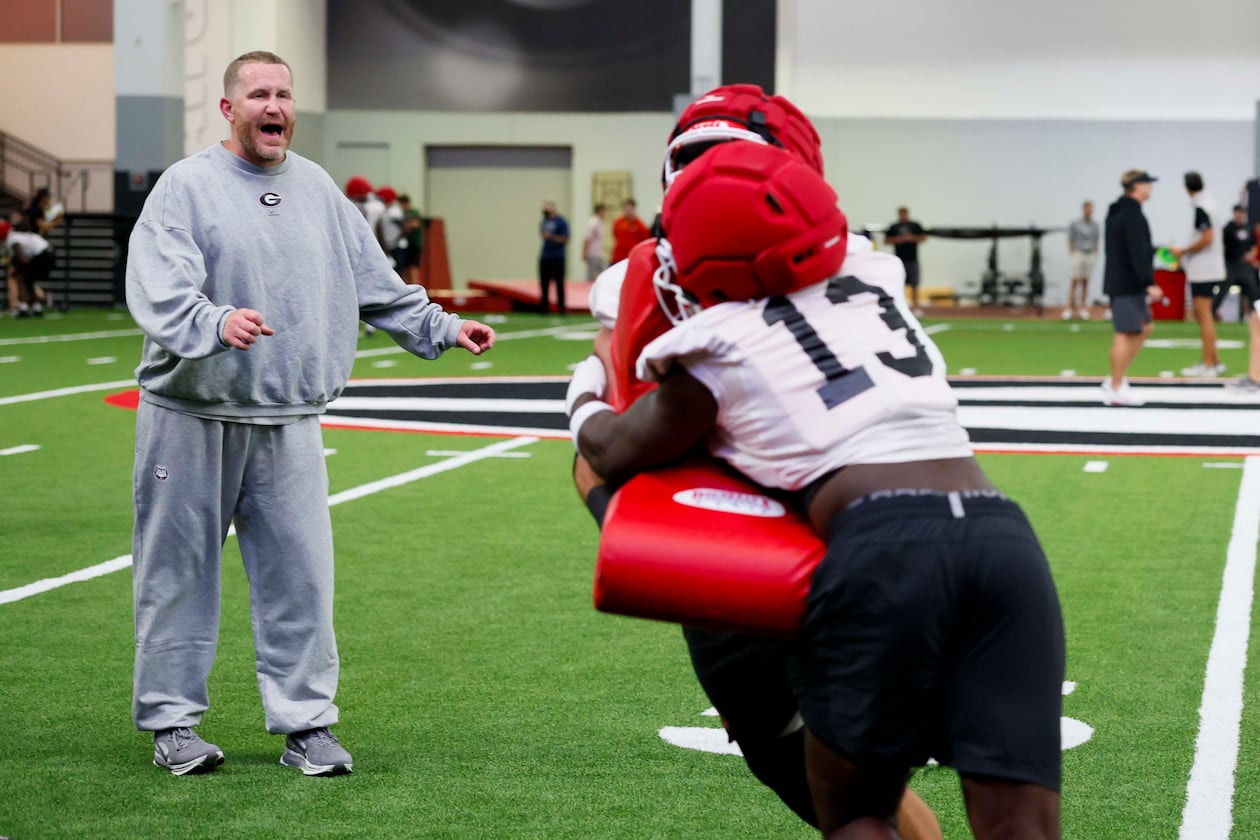 Georgia defensive coordinator Glenn Schumann yells instructions during the Bulldogs' first football practice at the UGA practice facility in Athens on Wednesday, Aug. 5, 2026. (Miguel Martinez/AJC)