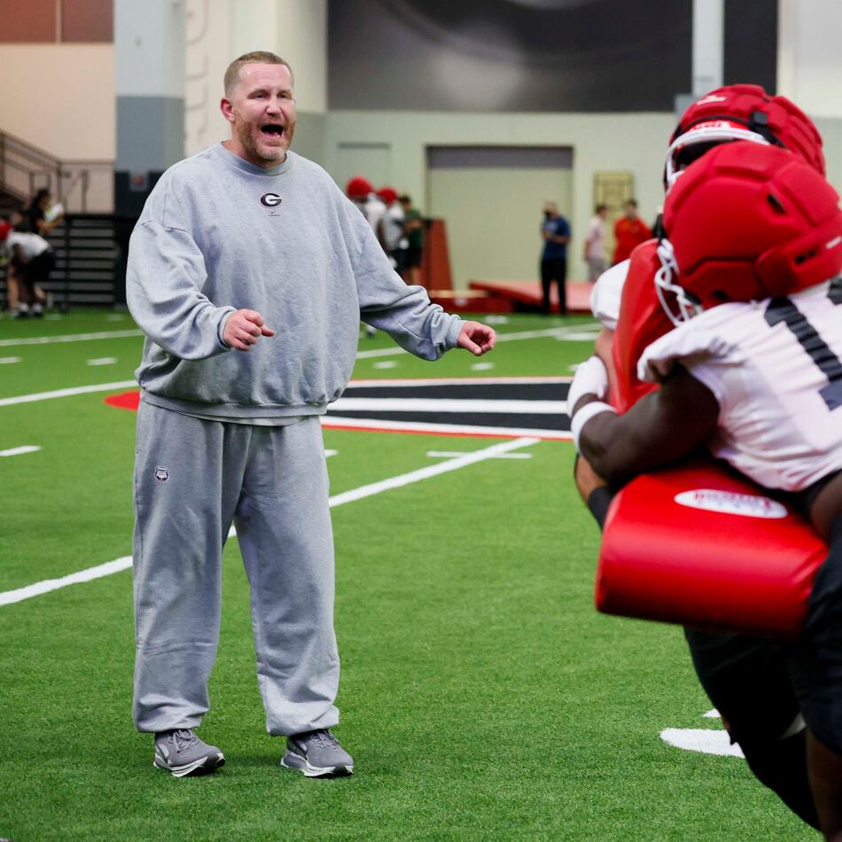 Georgia defensive coordinator Glenn Schumann yells instructions during the Bulldogs' first football practice at the UGA practice facility in Athens on Wednesday, Aug. 5, 2026. (Miguel Martinez/AJC)