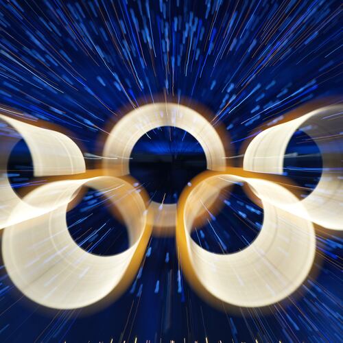 FILE - The Olympic rings are illuminated during the Olympic opening ceremony at the 2026 Winter Olympics, in Milan, Italy, Friday, Feb. 6, 2026. (AP Photo/Francisco Seco, File)