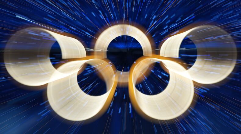FILE - The Olympic rings are illuminated during the Olympic opening ceremony at the 2026 Winter Olympics, in Milan, Italy, Friday, Feb. 6, 2026. (AP Photo/Francisco Seco, File)