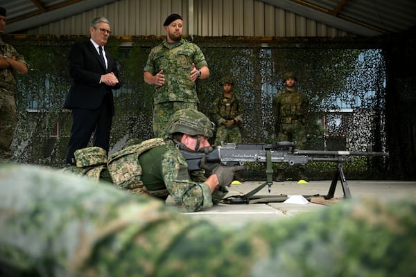 Britain's Prime Minister Keir Starmer, left, visits the Netherlands marines training base, as part of the UK-Netherlands Joint Amphibious Force in Rotterdam, Netherlands, Tuesday, June 24, 2025, on the sidelines of the NATO summit. (Ben Stansall/Pool via AP)