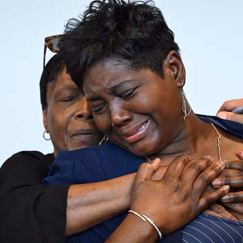 Danyel Smith’s fiancée, LaTasha Pyatt, foreground, becomes emotional following Smith’s bond hearing at Gwinnett County Superior Court on Tuesday, Sept. 1, 2026, in Lawrenceville. Danyel Smith, who was convicted in 2003 in the death of his baby, was recently granted a new trial. (Hyosub Shin/AJC)