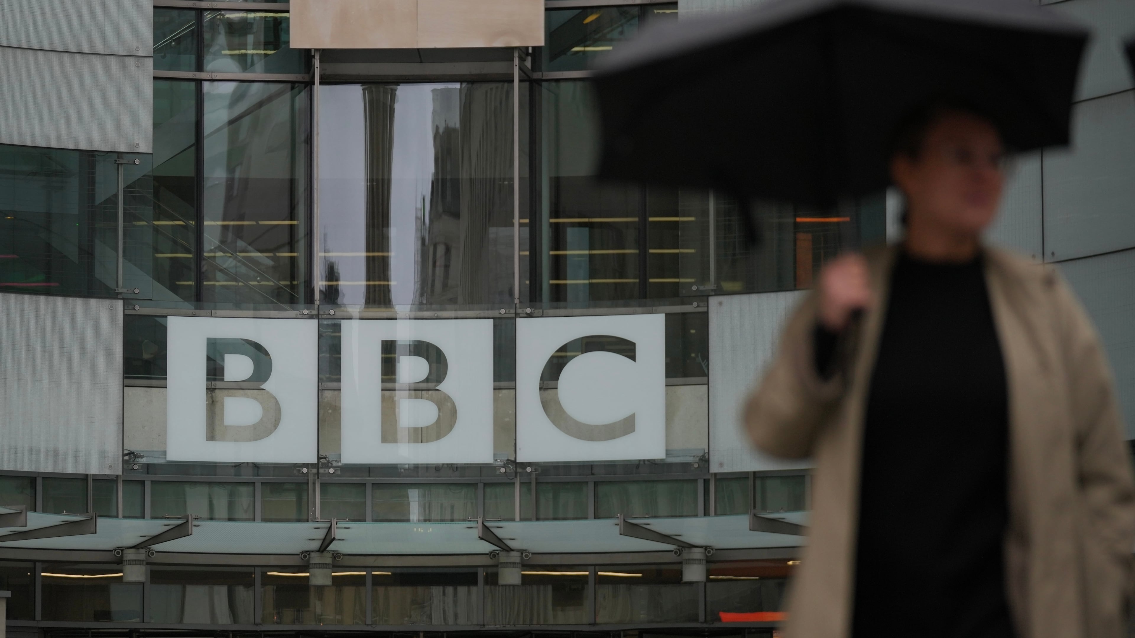 A man walks outside the BBC Headquarters in London, Monday, Nov. 10, 2025. (AP Photo/Kin Cheung)