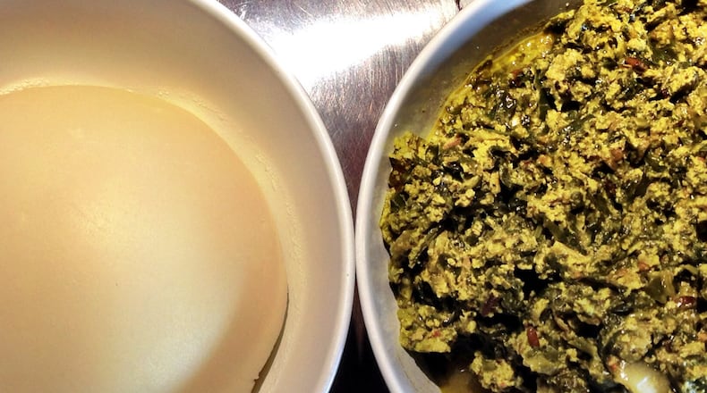 Pounded yam and egusi soup are a traditional West African pair served at Cafe Songhai. CONTRIBUTED BY WYATT WILLIAMS