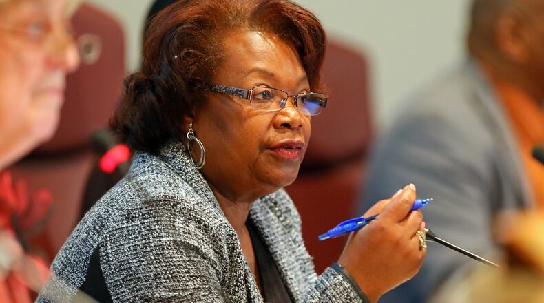 Clayton County Schools Superintendent Luvenia Jackson (center) is working to craft a deal with Utopian Academy for the Arts, a startup charter school, so that some 200 middle school students can begin classes there.