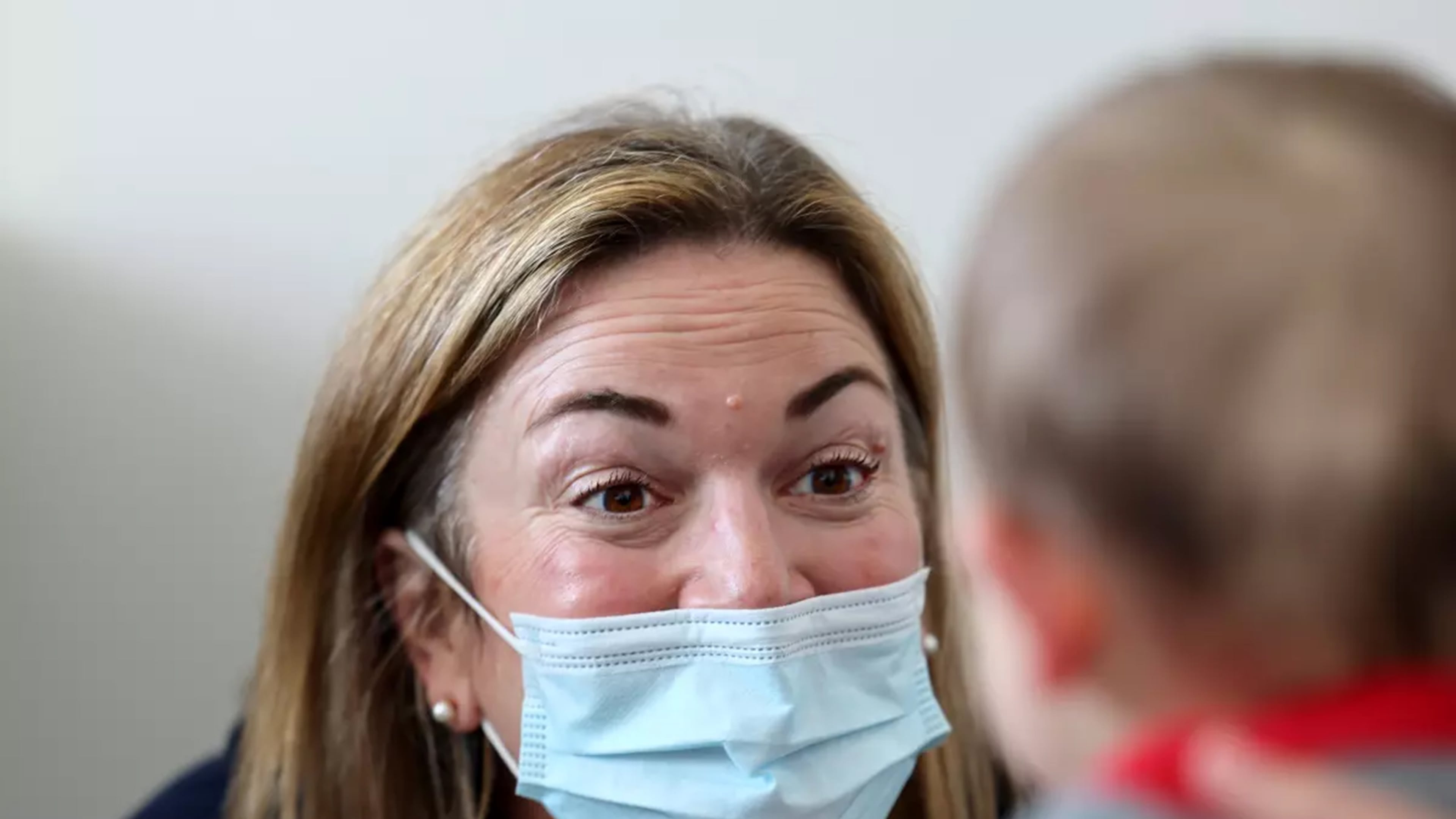 Dr. Neville Anderson (left) interacts with Arlo Vasquez held by his mom Christa Iacono (not pictured) while getting flu, Covid and Hepatitis B vaccinations at Larchmont Pediatrics in Los Angeles. (Allen J. Schaben/Los Angeles Times/TNS)