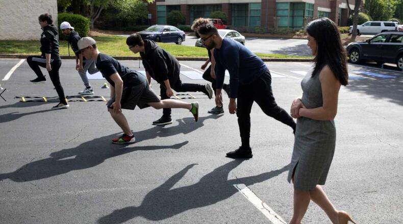 E-sports athletes break a sweat as part of Northside Hospital's new program to study and prevent injuries of video gamers.