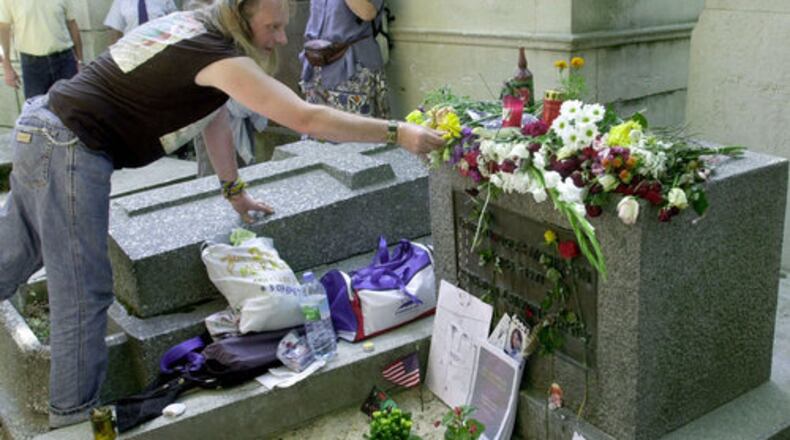 A fan places flowers on Jim Morrison's grave at the Pere Lachaise cemetery in Paris. Patricia Kennealy-Morrison, who wrote about rock when music journalists were just beginning to take it seriously, and through her work met Morrison, frontman of the Doors, with whom she said she had a marriage of sorts, died July 23. She was 75.