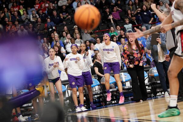 The LSU bench celebrates during the second half against North Carolina State in the Sweet 16 of the NCAA college basketball tournament, Friday, March 28, 2025, in Spokane, Wash. (AP Photo/Young Kwak)
