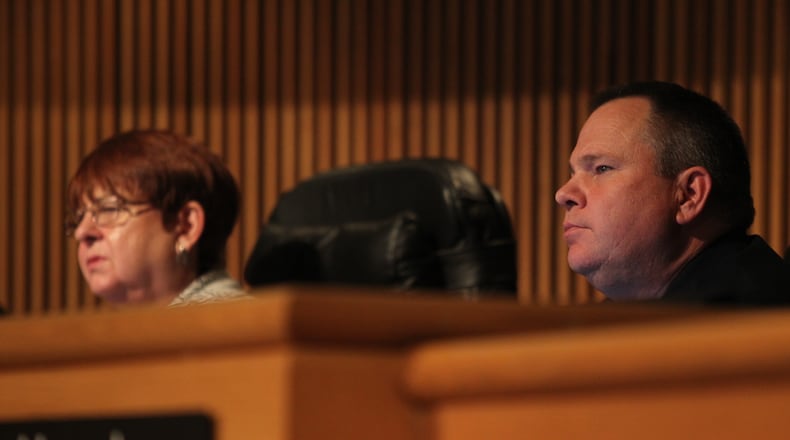 Gwinnett County Commissioner Tommy Hunter sits beside Chairman Charlotte Nash during a Jan. 17 meeting. (HENRY TAYLOR / HENRY.TAYLOR@AJC.COM)